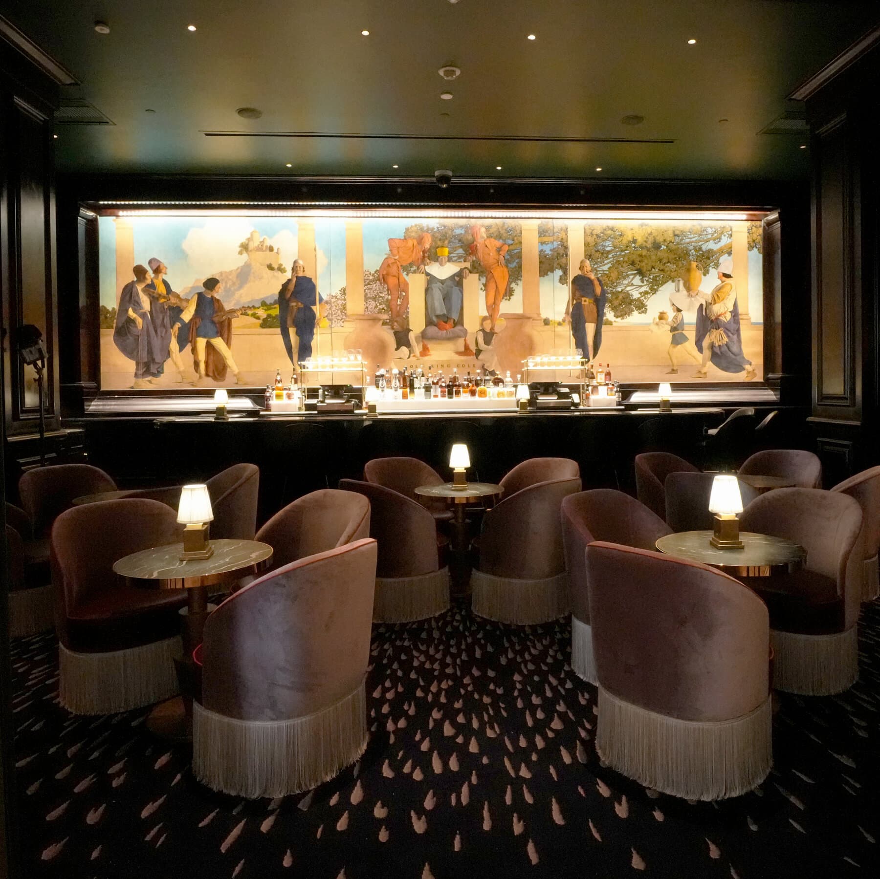 Framed artwork being mounted on a café wall